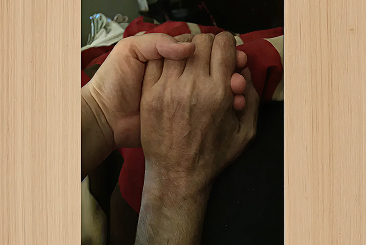 This is my husband’s hand in mine.  Taken in hospice, 2016. The day before he died.